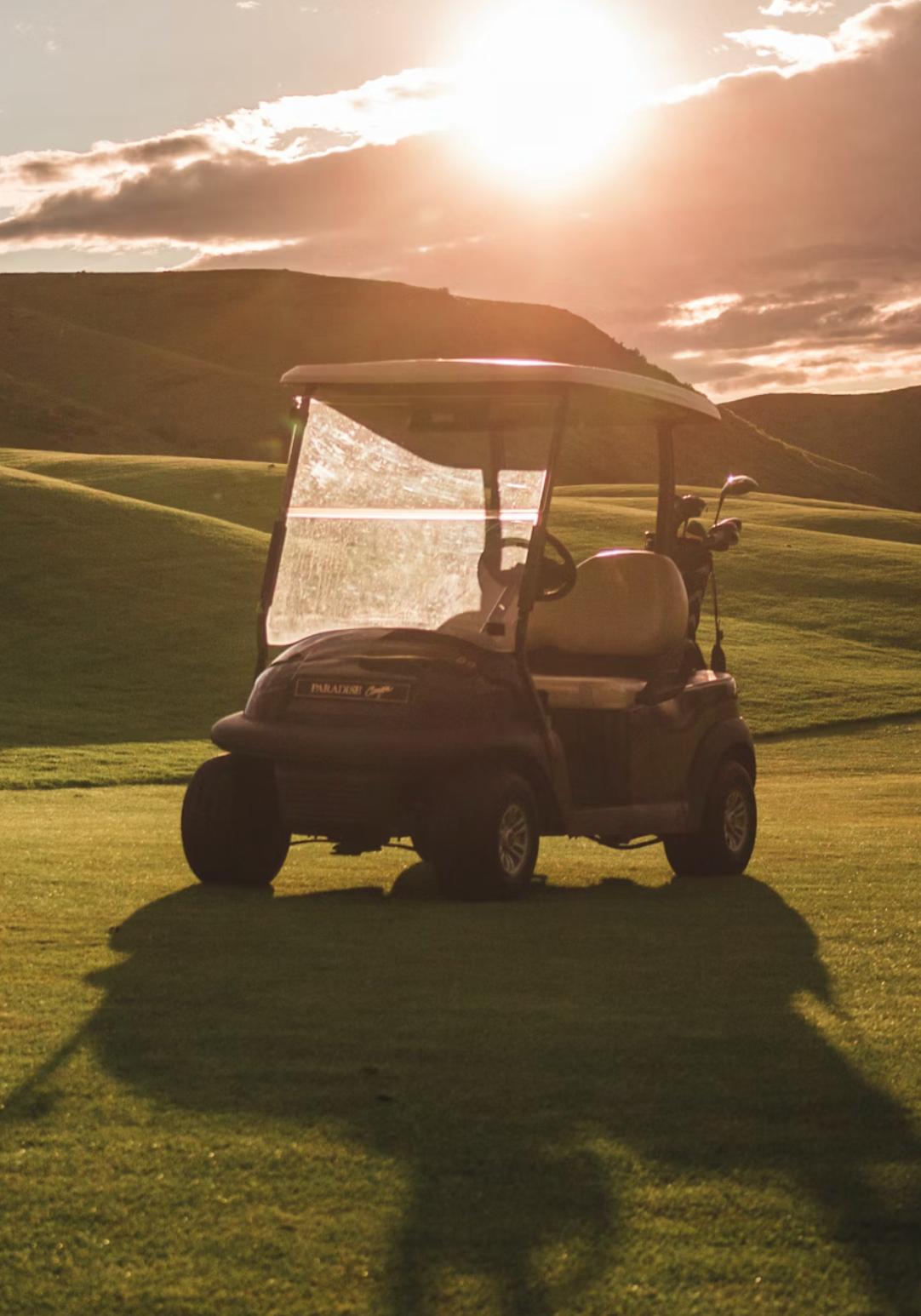 Technician troubleshooting a golf cart battery not charging, connected to a Battery Tender charger