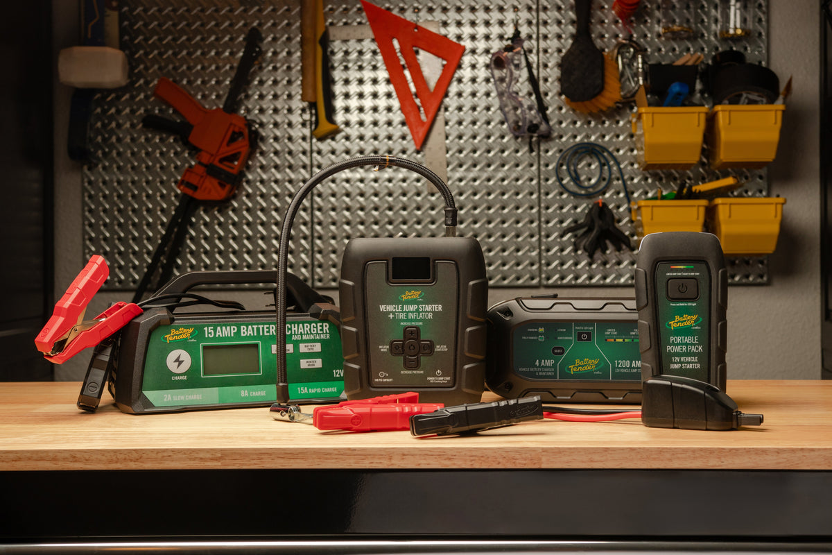 Battery Tender® smart battery charger connected to a car battery in a clean garage workshop