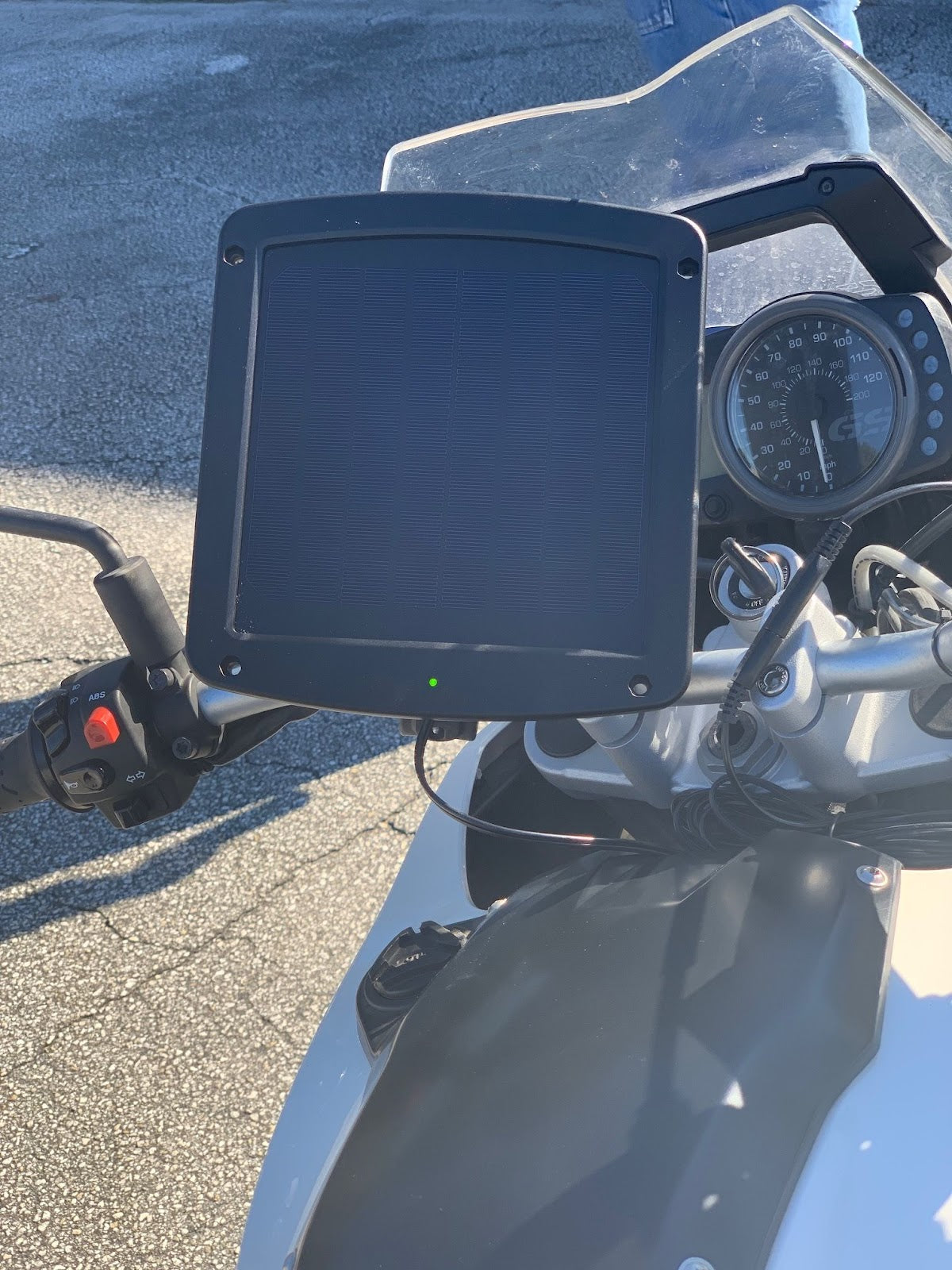 The 5 Watt Solar 12V Battery Charger Mounted on a Motorcycle
