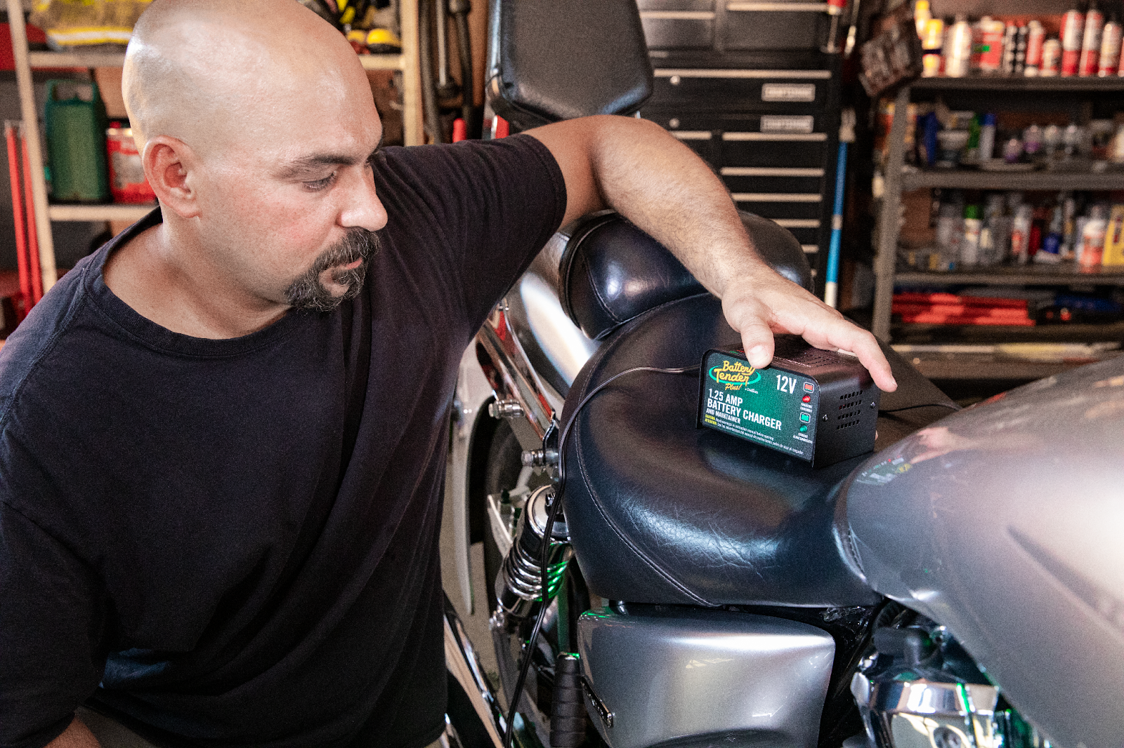 Man Using the Battery Tender Plus 12V, 1.25 AMP Battery Charger on Motorcycle