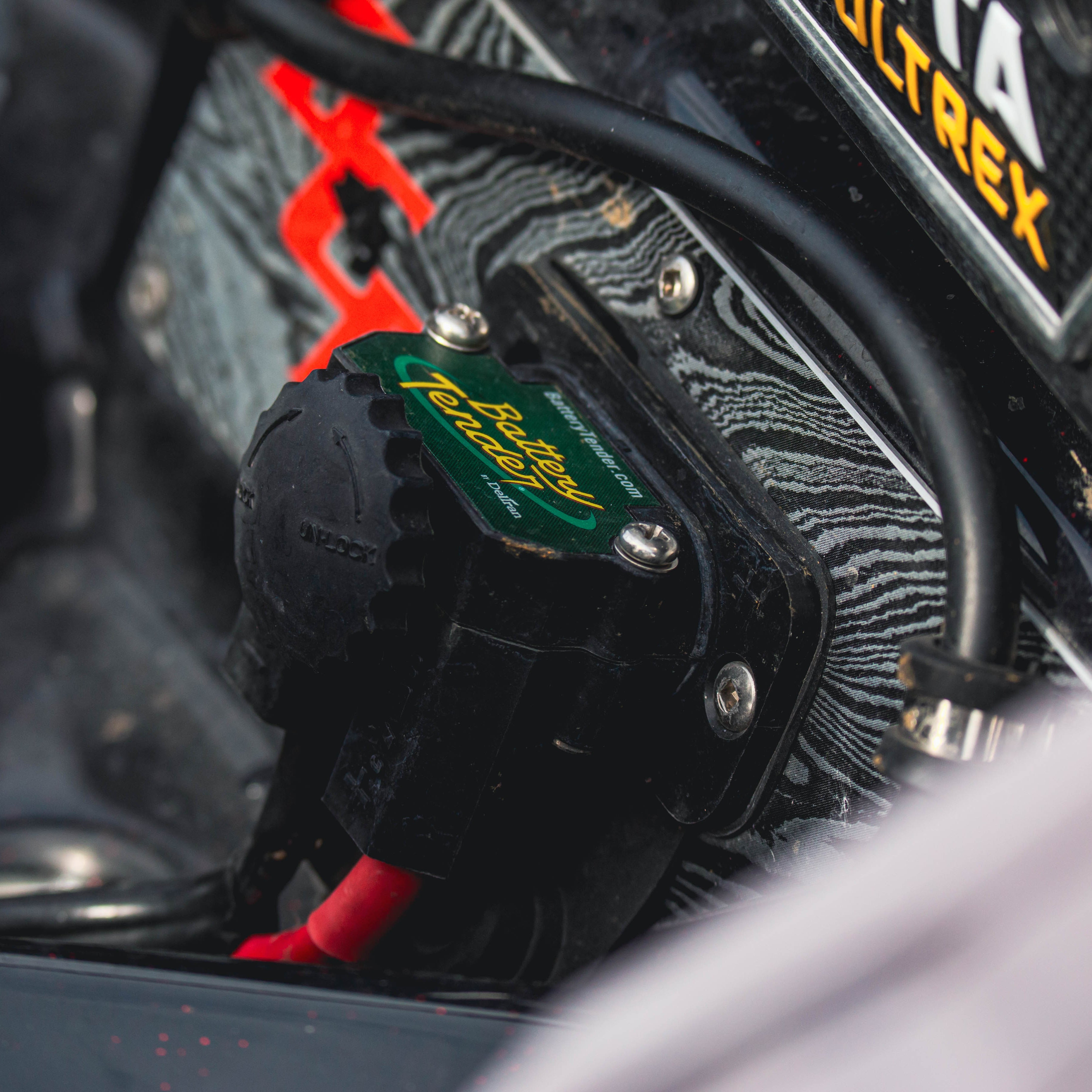 Close-up of a dc to dc trolling motor plug accessory with branding visible