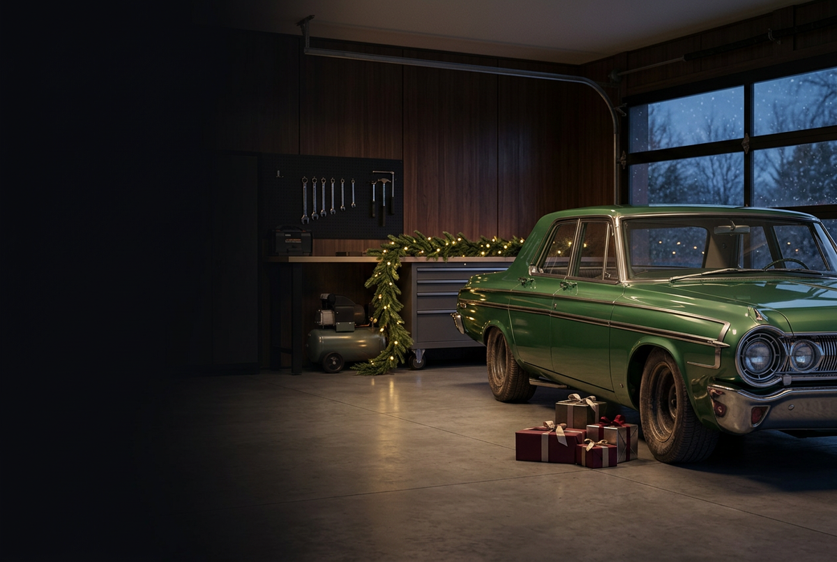 Holiday banner with a green classic car, warm garage lighting, and wrapped gifts
