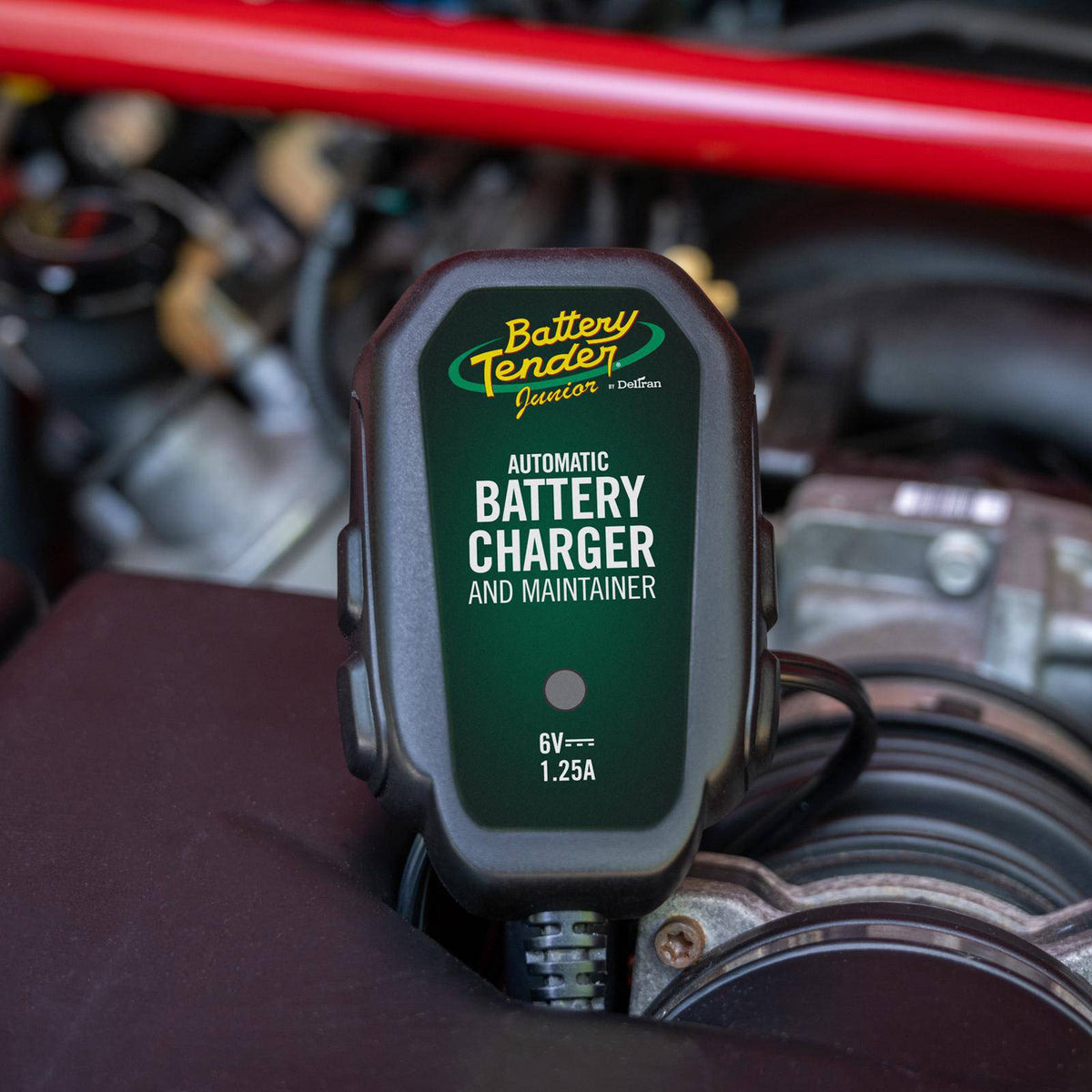 Battery Tender® charger connected to a vintage classic car battery during long-term storage maintenance