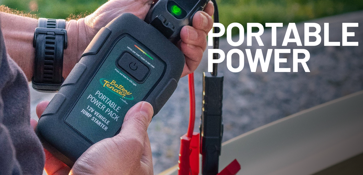 Battery Tender® portable car jumper connected to a vehicle battery in a roadside recovery situation