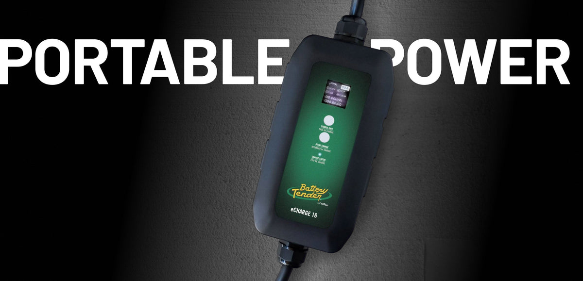 Person using a Battery Tender® portable EV charger to charge an electric vehicle in a driveway