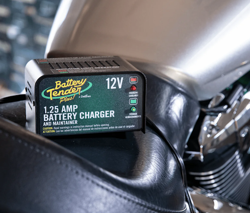The Battery Tender Plus 1.25 AMP 12V Battery Charger and Maintainer on Seat of Motorcycle