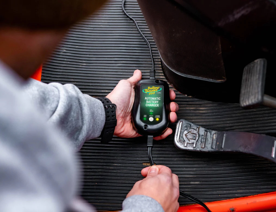 Person Using the Battery Tender Weather Resistant 800mA, 12V Battery Charger